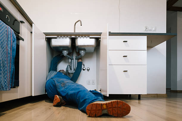 Professional Drain Cleaning technician working in Pella, IA
